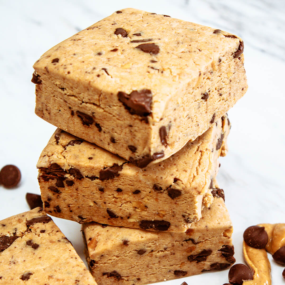 Stack of peanut butter chocolate bars on a white background
