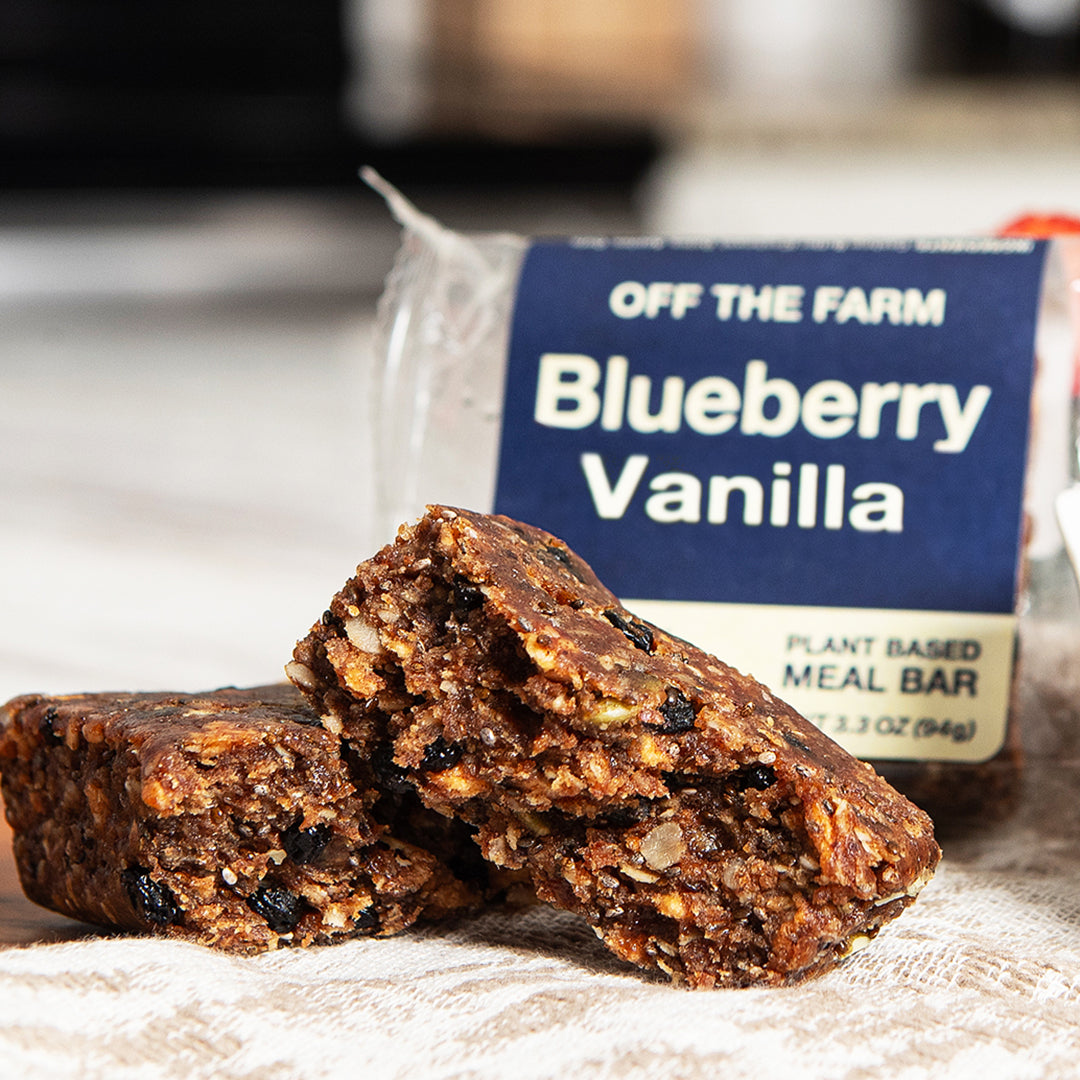 Blueberry Vanilla meal bar with packaging labeled 'Off The Farm' on a linen cloth