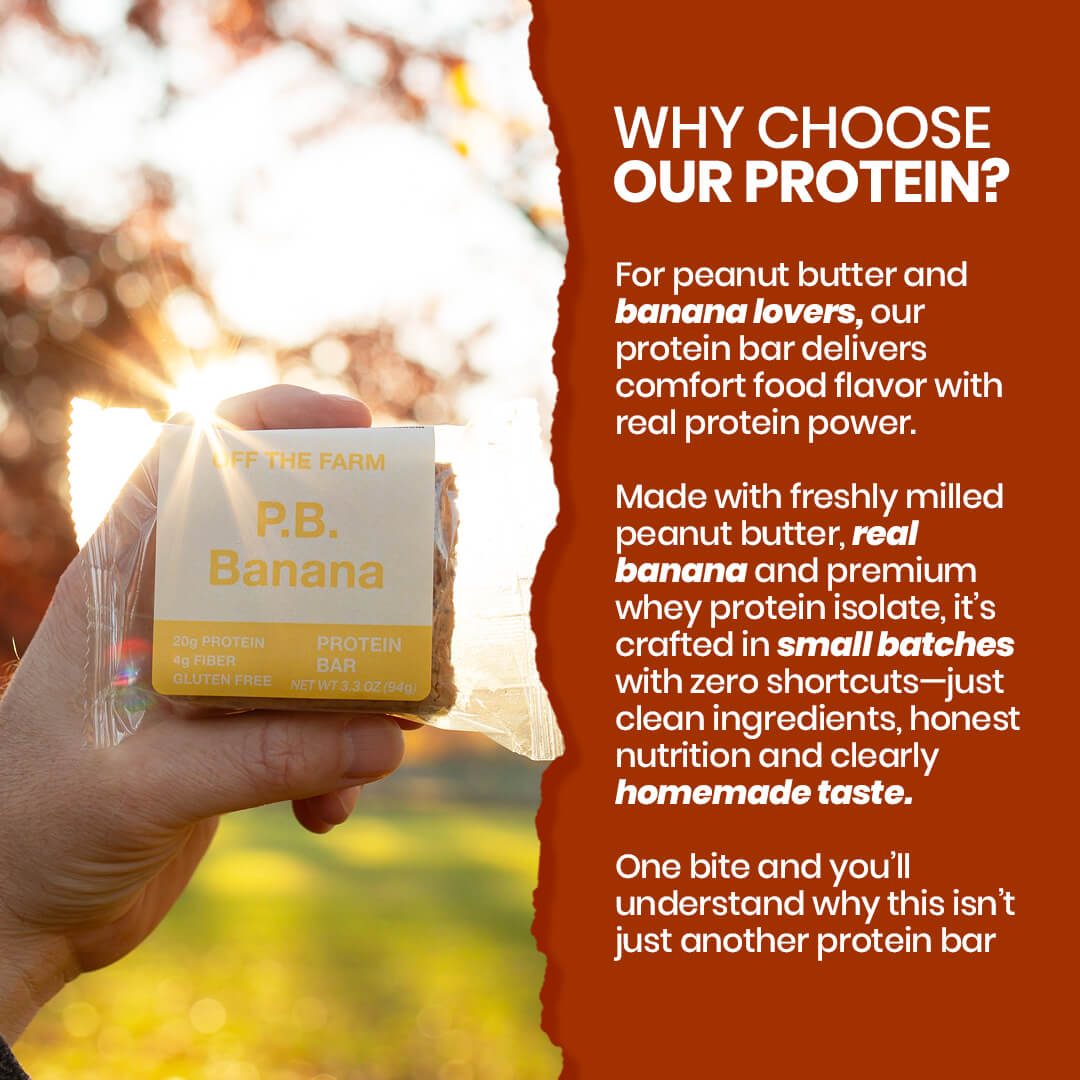 P.B. Banana Protein bar packaging with text about its ingredients and benefits, held by a hand outdoors.