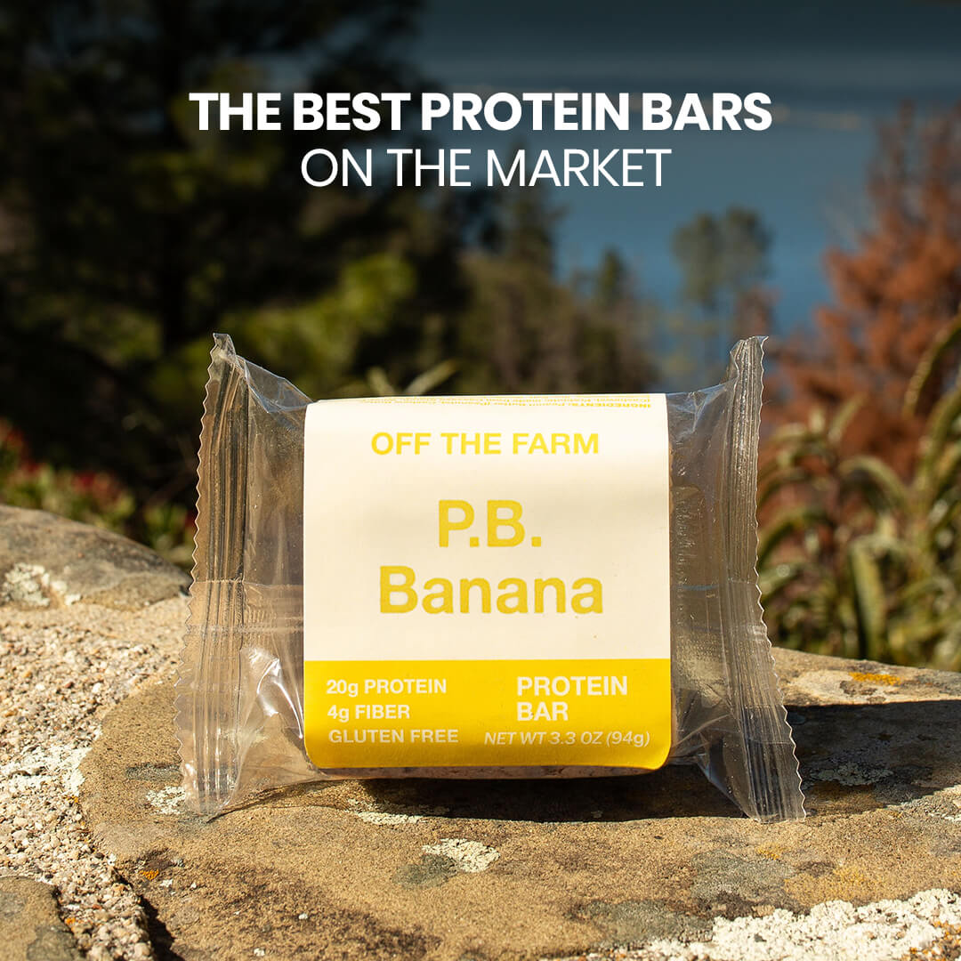 P.B. Banana protein bar packaging on a rock with nature in the background
