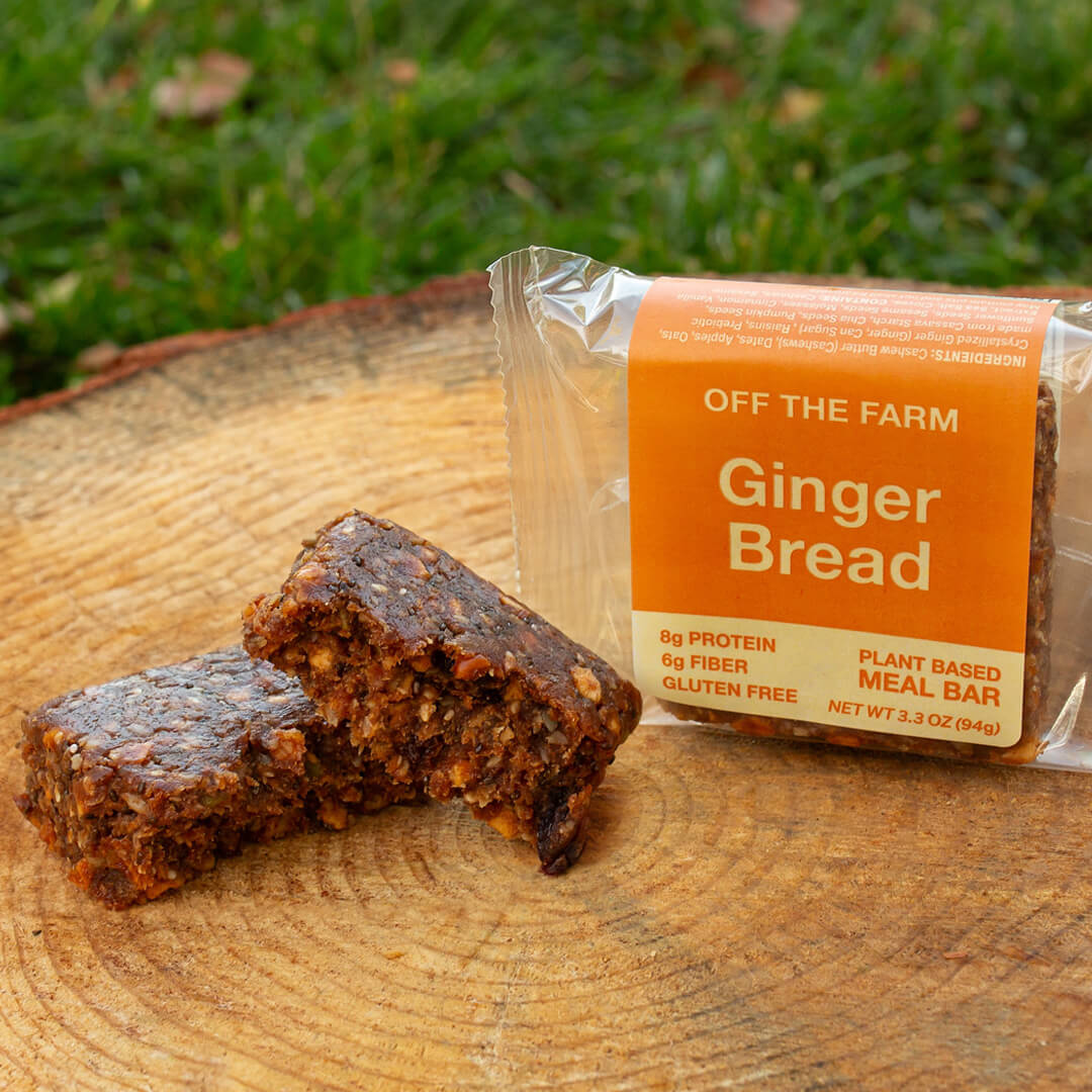 OFF THE FARM Gingerbread meal bar with packaging on a wooden surface outdoors