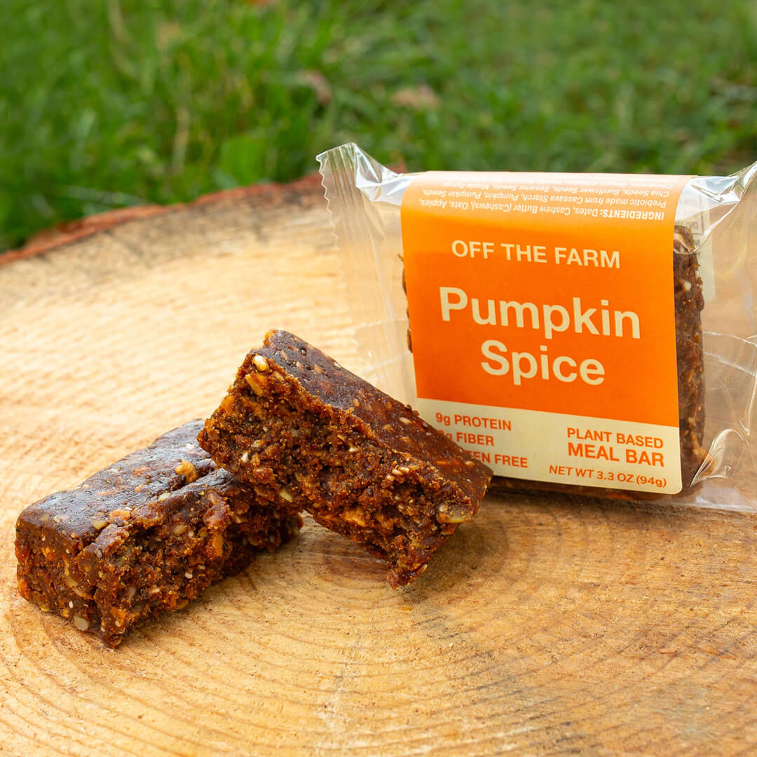 Pumpkin spice meal bar with packaging on a wooden surface