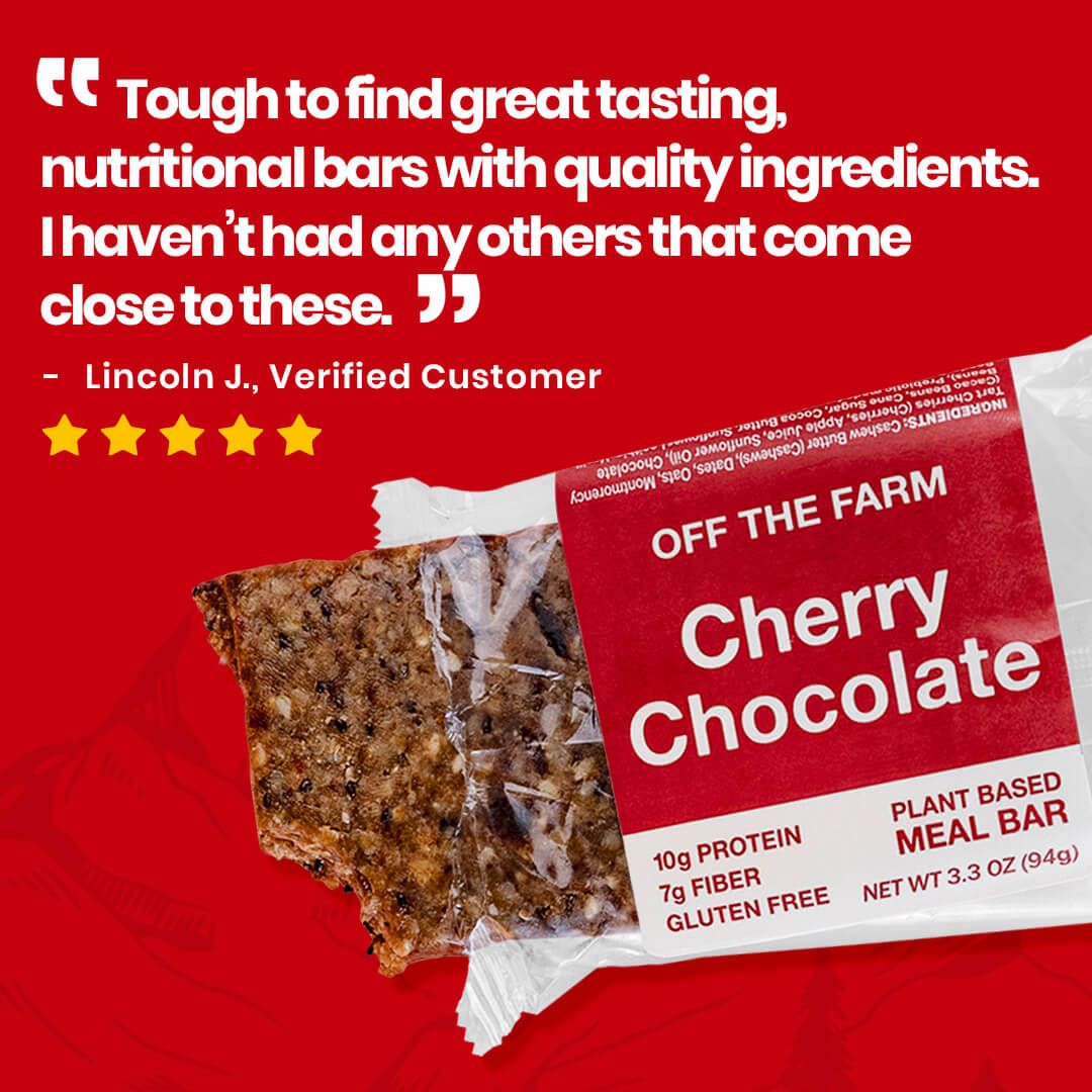 Meal bar packaging with cherry chocolate flavor on a red background, featuring a customer review.