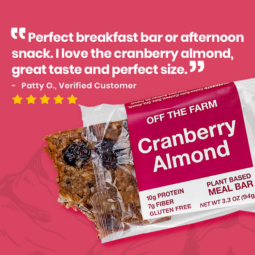 Cranberry almond meal bar packaging with customer review on pink background