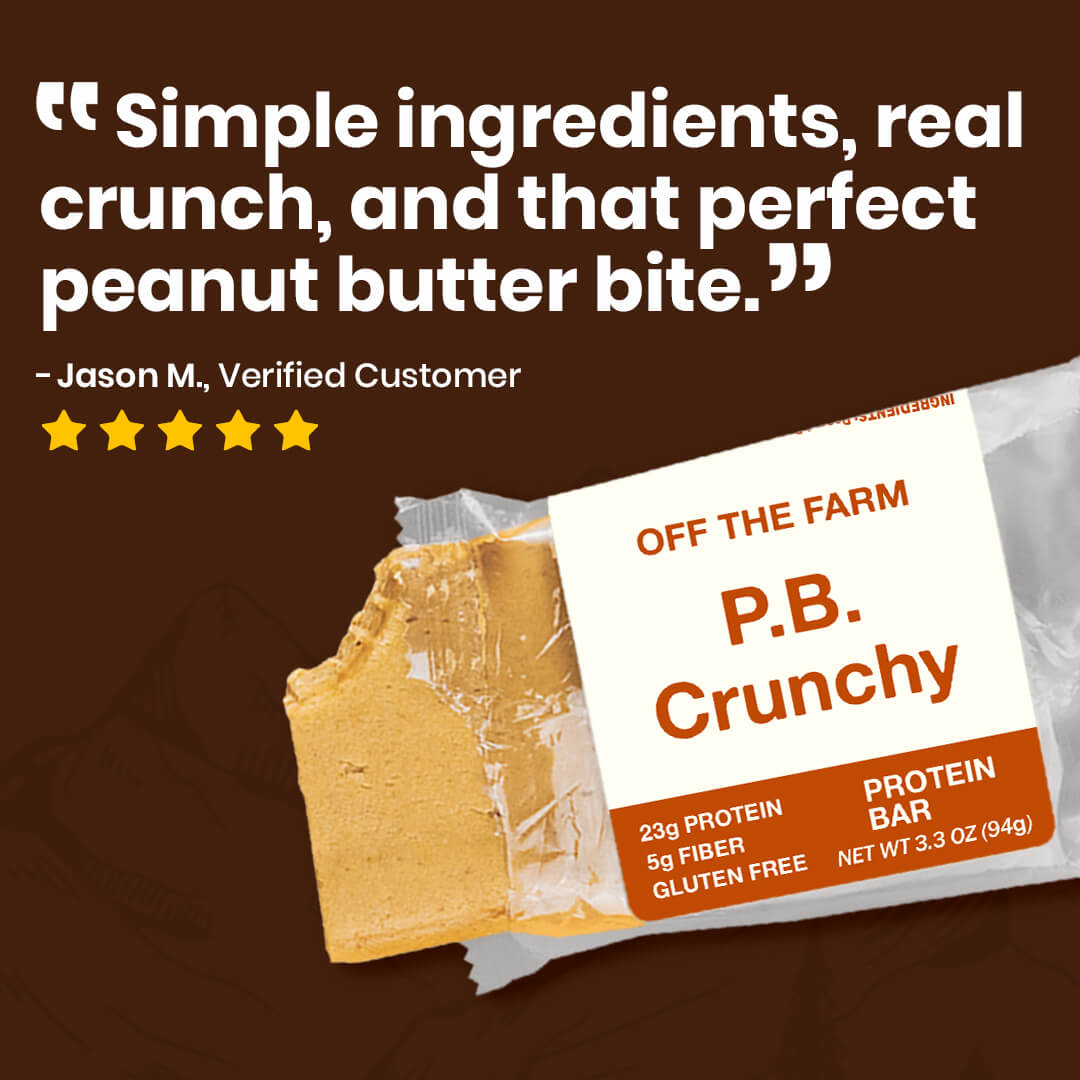P.B. Crunchy protein bar with packaging and a review on a brown background