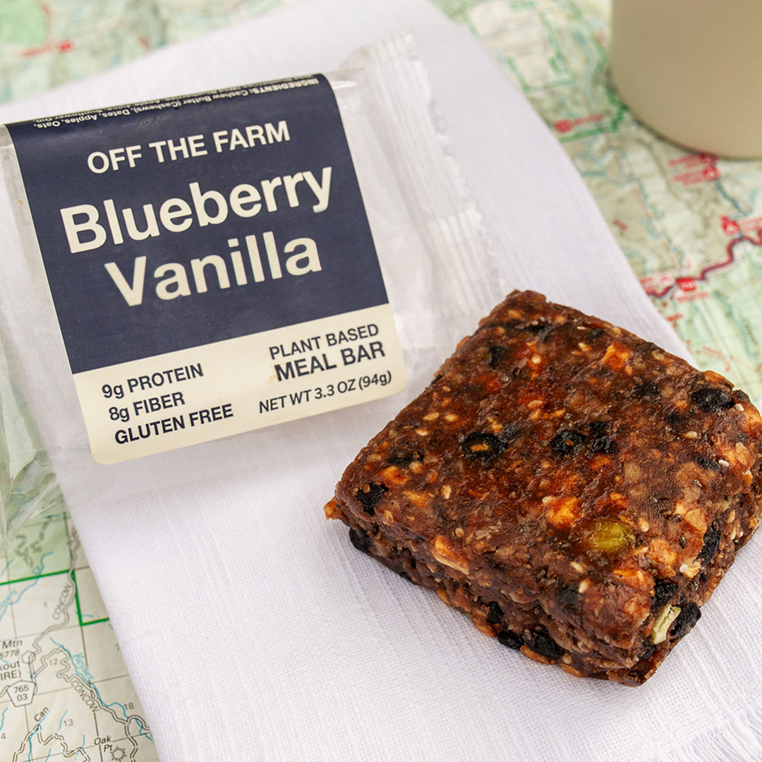Blueberry Vanilla meal bar with packaging on a map background