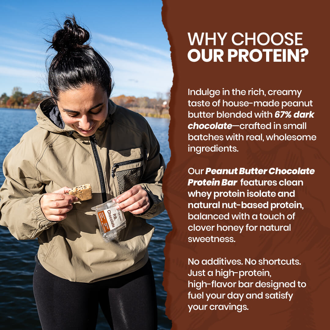 Person eating an Off The Farm protein bar by a lake with promotional text about the product.